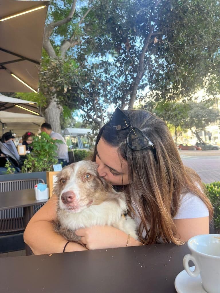 A sitter sharing an affectionate moment with a dog during a live-in stay
